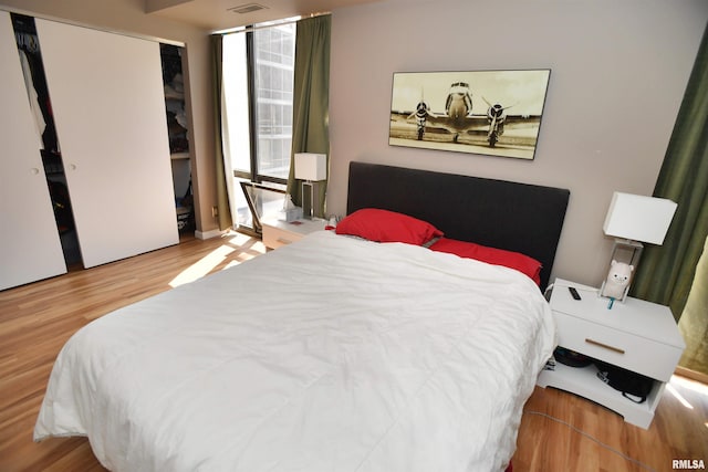 125 SW Jefferson Ave Unit W4S, Peoria, IL 61602 - bedroom featuring wood finished floors