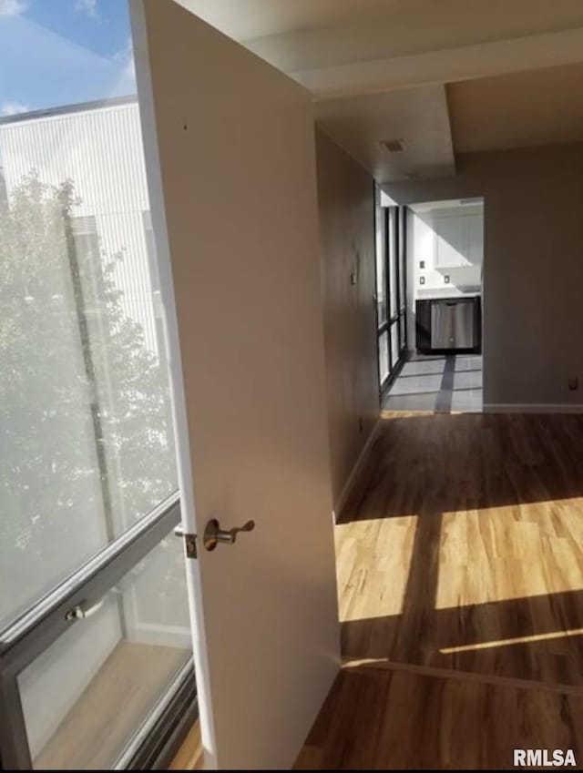 125 SW Jefferson Ave Unit W4S, Peoria, IL 61602 - corridor featuring wood finished floors and baseboards
