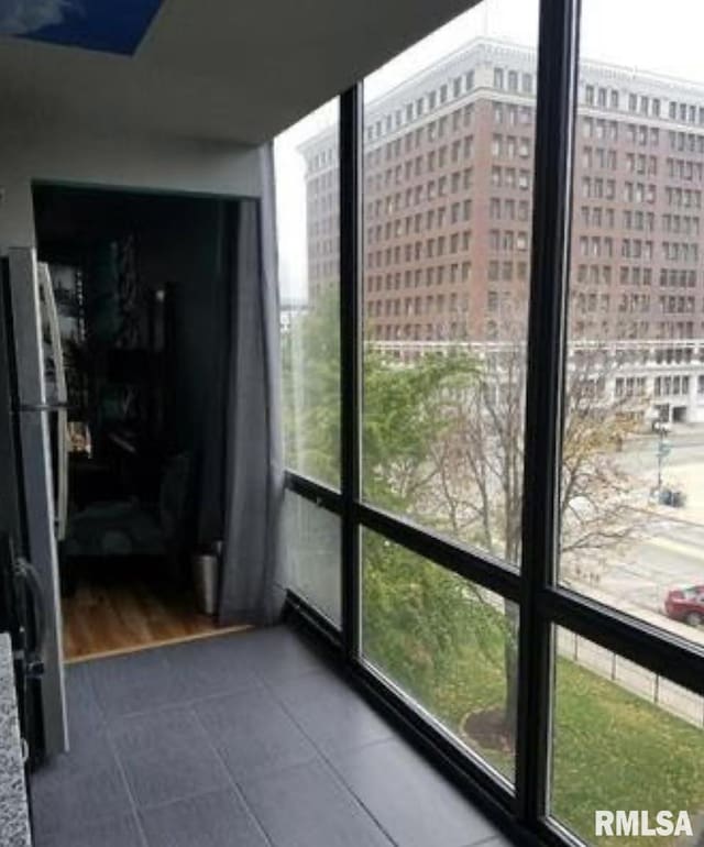 125 SW Jefferson Ave Unit W4S, Peoria, IL 61602 - unfurnished sunroom featuring healthy amount of natural light