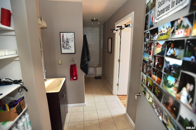 125 SW Jefferson Ave Unit W4S, Peoria, IL 61602 - bathroom featuring vanity, tile patterned flooring, and baseboards