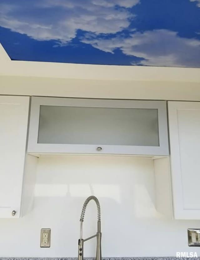 125 SW Jefferson Ave Unit W4S, Peoria, IL 61602 - kitchen view of glass insert cabinets and white cabinetry