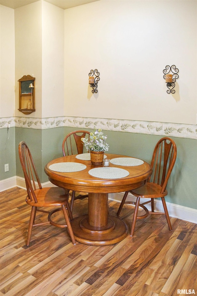418 W Clinton St, Toulon, IL 61483 - dining room with wood finished floors and baseboards