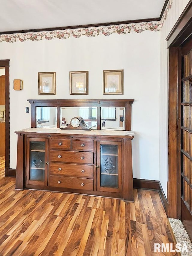418 W Clinton St, Toulon, IL 61483 - bar area featuring baseboards and wood finished floors