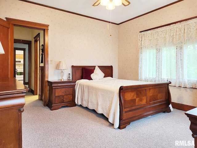 418 W Clinton St, Toulon, IL 61483 - bedroom with light colored carpet, crown molding, wallpapered walls, and ceiling fan