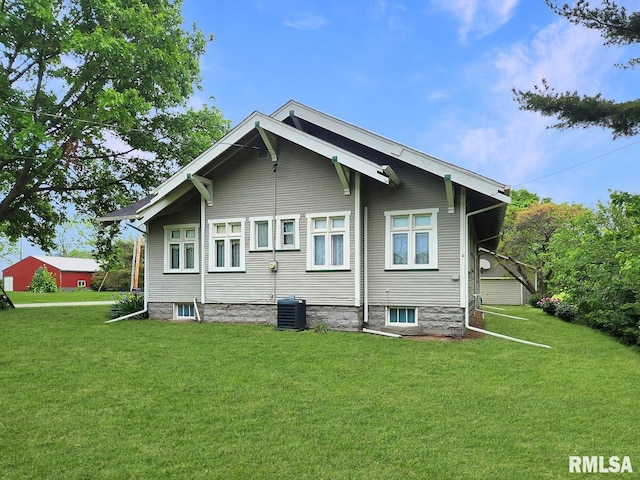 418 W Clinton St, Toulon, IL 61483 - back of house with a yard and central AC