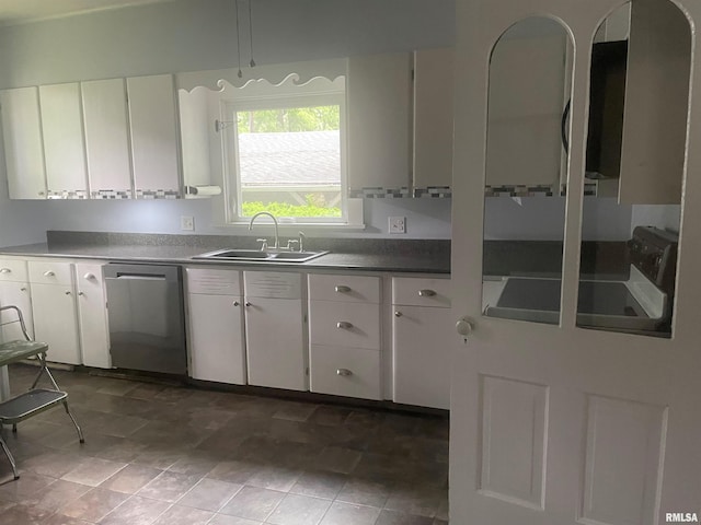 623 S Randolph St, Macomb, IL 61455 - kitchen with dishwasher, a sink, white cabinets, and dark countertops