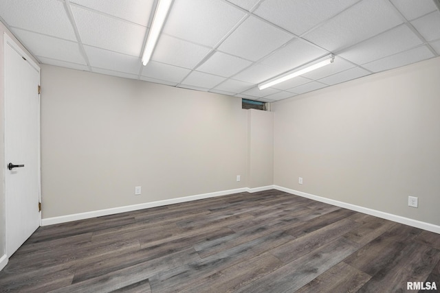 208 W Graze Ave, Dunlap, IL 61525 - finished below grade area featuring dark wood-style floors, a paneled ceiling, and baseboards