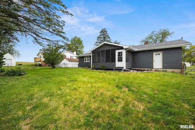 208 W Graze Ave, Dunlap, IL 61525 - rear view of house with a sunroom and a chimney