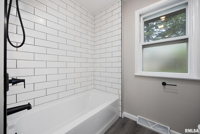 208 W Graze Ave, Dunlap, IL 61525 - full bath with wood finished floors, baseboards, and  shower combination