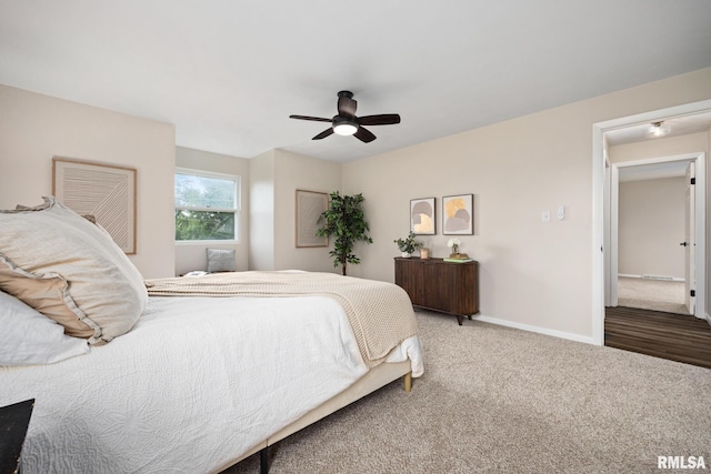 3348 W Lisa Ln, Peoria, IL 61615 - carpeted bedroom featuring baseboards and a ceiling fan