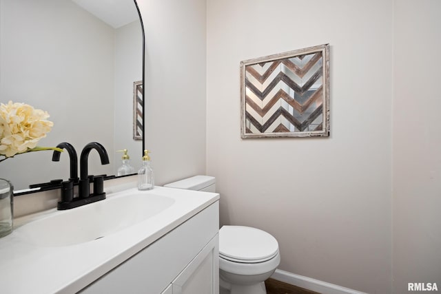 3348 W Lisa Ln, Peoria, IL 61615 - bathroom with vanity, toilet, and baseboards