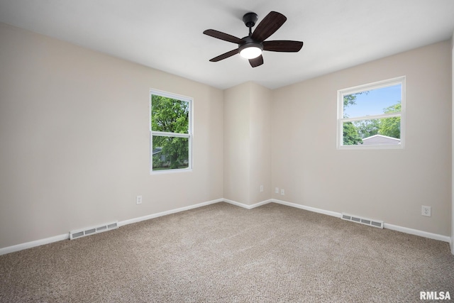 3348 W Lisa Ln, Peoria, IL 61615 - carpeted spare room with a ceiling fan and baseboards