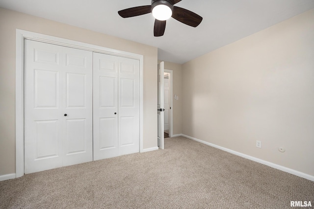 3348 W Lisa Ln, Peoria, IL 61615 - unfurnished bedroom featuring carpet flooring, a closet, baseboards, and a ceiling fan