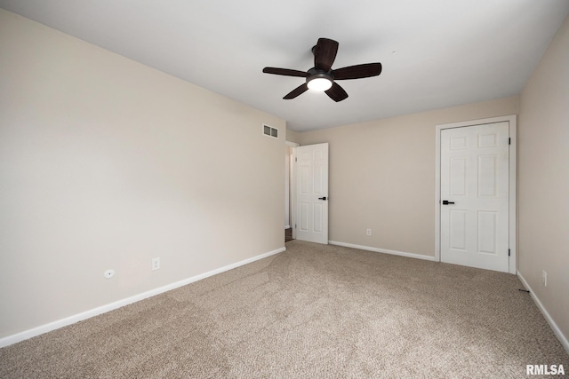 3348 W Lisa Ln, Peoria, IL 61615 - unfurnished bedroom featuring carpet, baseboards, and a ceiling fan