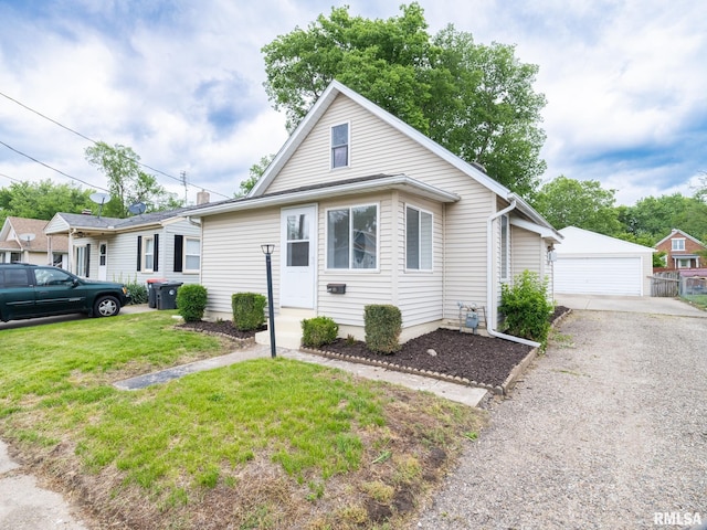 1210 Mechanic St, Pekin, IL 61554 - bungalow-style house with an outdoor structure, a front lawn, and a garage