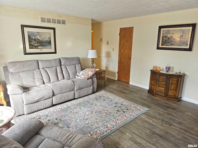 3303 W Chartwell Rd, Peoria, IL 61614 - living room with wood finished floors, baseboards, and a textured ceiling