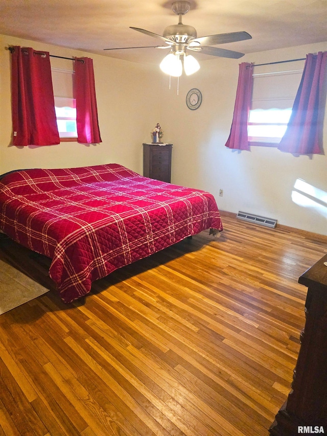 3303 W Chartwell Rd, Peoria, IL 61614 - bedroom with wood finished floors and a ceiling fan
