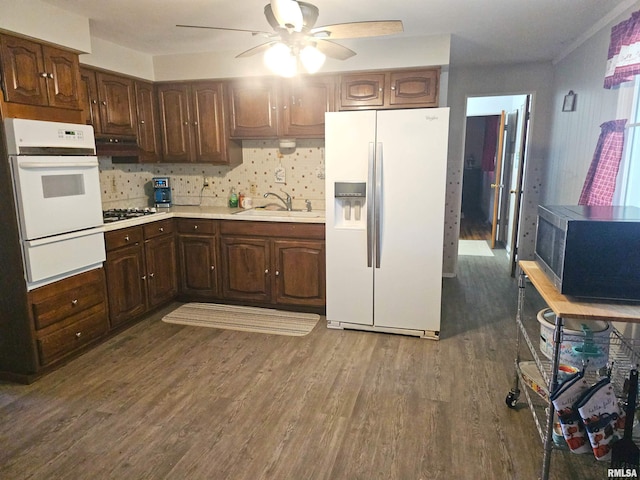 3303 W Chartwell Rd, Peoria, IL 61614 - kitchen with white appliances, a warming drawer, a ceiling fan, light countertops, and dark wood-style flooring