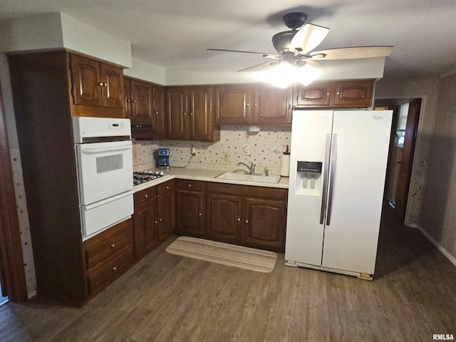 3303 W Chartwell Rd, Peoria, IL 61614 - kitchen featuring white appliances, a sink, a warming drawer, and dark wood-type flooring
