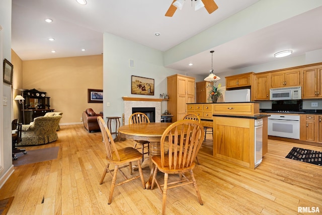 131 Lakeside Pl, Dahinda, IL 61428 - dining space with a fireplace, light wood-style flooring, a ceiling fan, baseboards, and recessed lighting