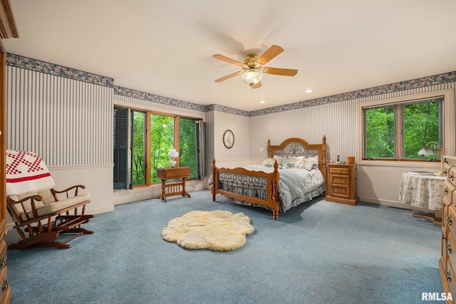 131 Lakeside Pl, Dahinda, IL 61428 - bedroom featuring multiple windows, carpet floors, wallpapered walls, and baseboards