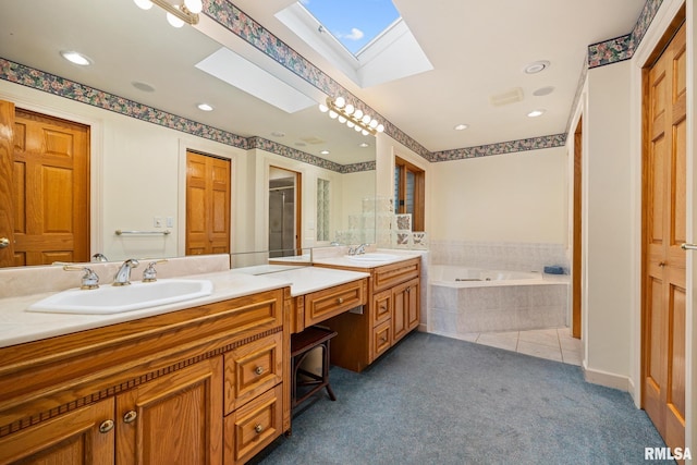 131 Lakeside Pl, Dahinda, IL 61428 - bathroom with a skylight, double vanity, a bath, recessed lighting, and tile patterned floors