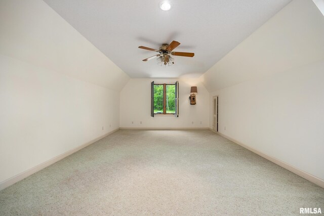 131 Lakeside Pl, Dahinda, IL 61428 - additional living space with lofted ceiling, ceiling fan, light carpet, and baseboards