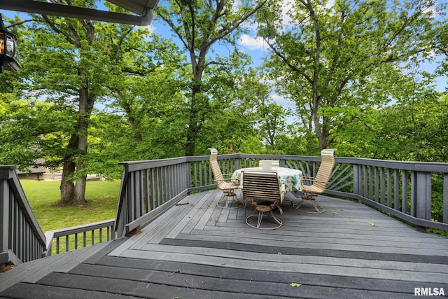 131 Lakeside Pl, Dahinda, IL 61428 - deck with outdoor dining space and a lawn