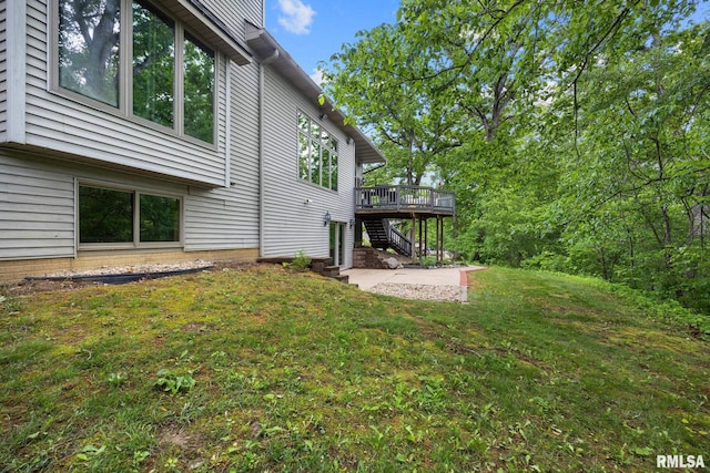 131 Lakeside Pl, Dahinda, IL 61428 - view of green lawn with a wooden deck, stairs, and a patio