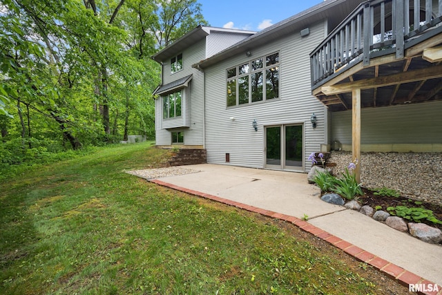 131 Lakeside Pl, Dahinda, IL 61428 - rear view of property featuring a yard, a patio, and a wooden deck