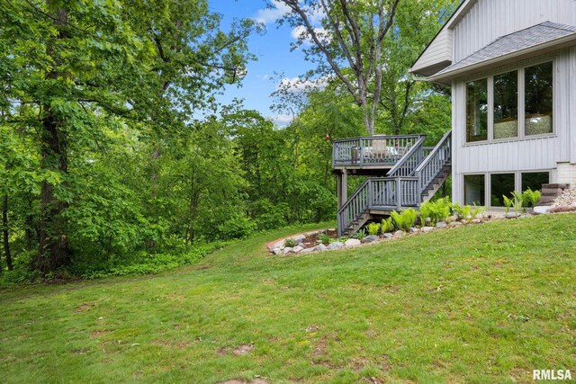 131 Lakeside Pl, Dahinda, IL 61428 - view of green lawn featuring stairs and a deck
