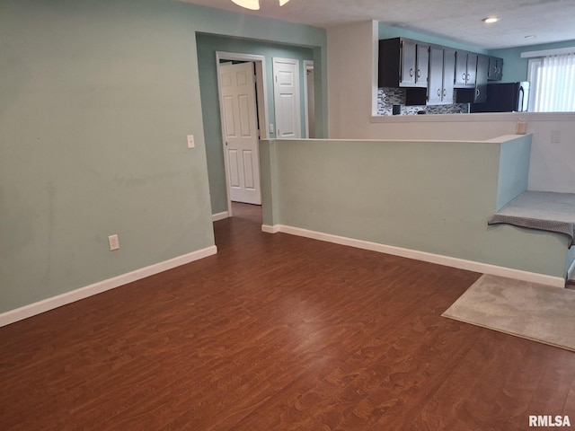 1907 Chicory Rd, Pekin, IL 61554 - unfurnished living room with dark wood-type flooring, baseboards, and recessed lighting