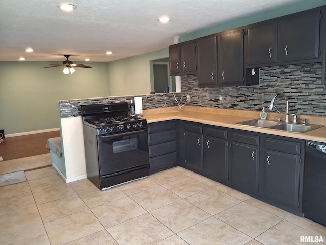 1907 Chicory Rd, Pekin, IL 61554 - kitchen featuring black appliances, a sink, decorative backsplash, a ceiling fan, and light countertops