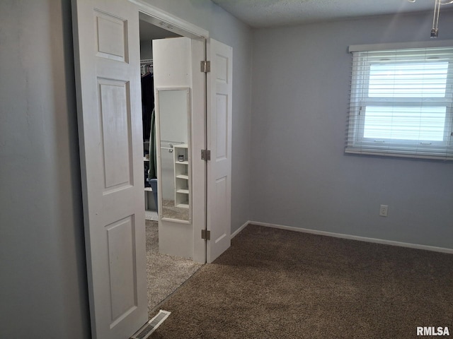 1907 Chicory Rd, Pekin, IL 61554 - unfurnished bedroom featuring carpet and baseboards