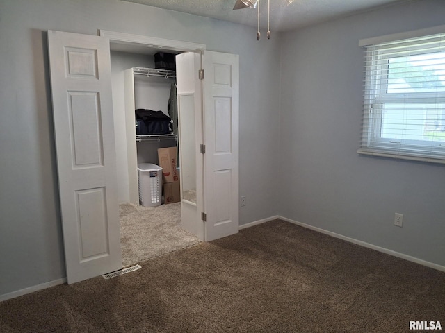 1907 Chicory Rd, Pekin, IL 61554 - unfurnished bedroom with carpet flooring, a closet, and baseboards