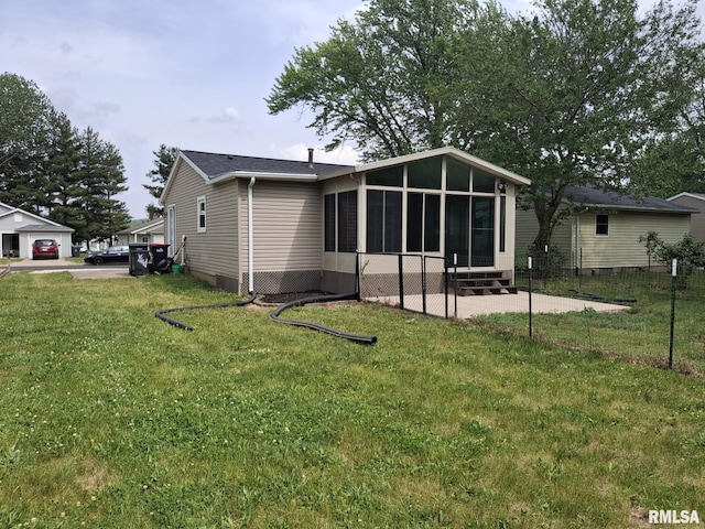 1907 Chicory Rd, Pekin, IL 61554 - rear view of house with a sunroom and a yard