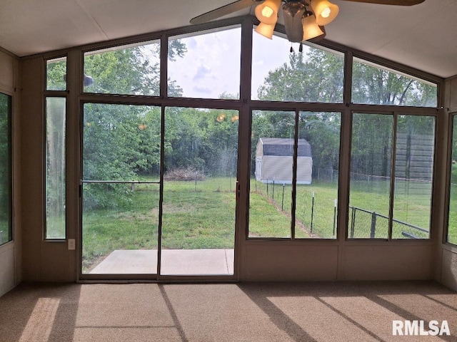 1907 Chicory Rd, Pekin, IL 61554 - unfurnished sunroom featuring carpet flooring, ceiling fan, plenty of natural light, and vaulted ceiling