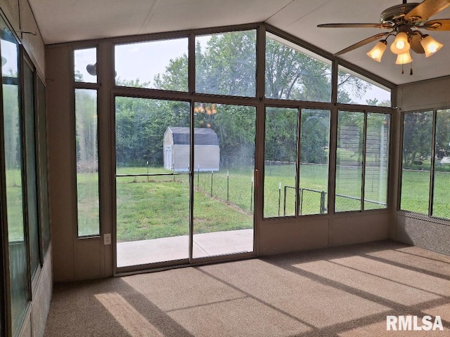 1907 Chicory Rd, Pekin, IL 61554 - unfurnished sunroom featuring carpet flooring, vaulted ceiling, and ceiling fan