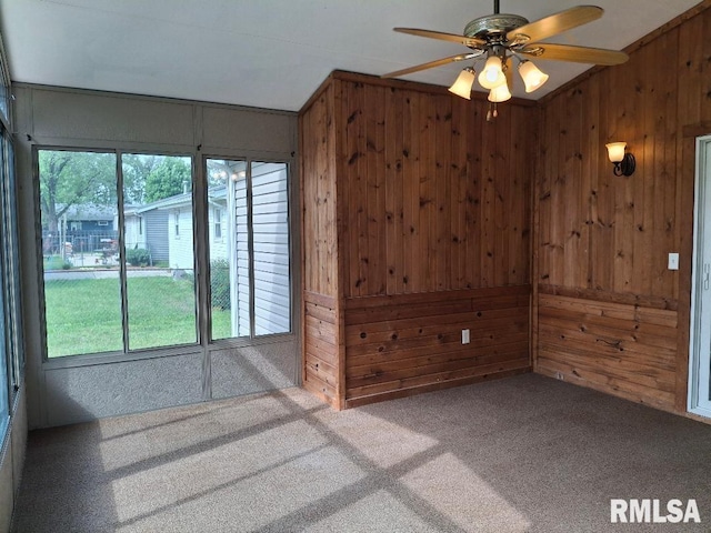 1907 Chicory Rd, Pekin, IL 61554 - carpeted empty room with wooden walls, ceiling fan, and vaulted ceiling