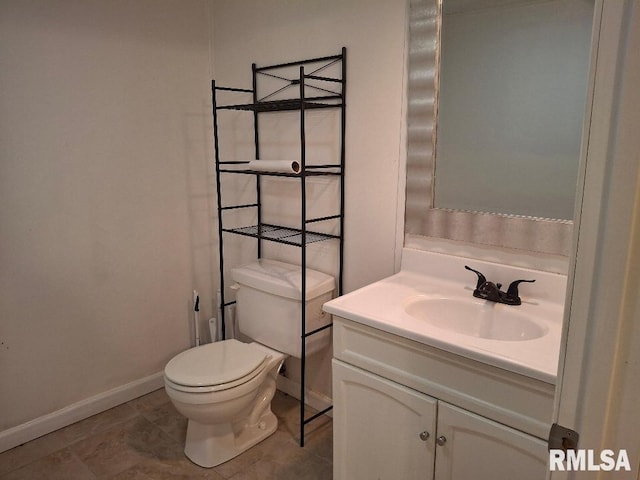 1907 Chicory Rd, Pekin, IL 61554 - half bathroom with baseboards, vanity, toilet, and tile patterned floors