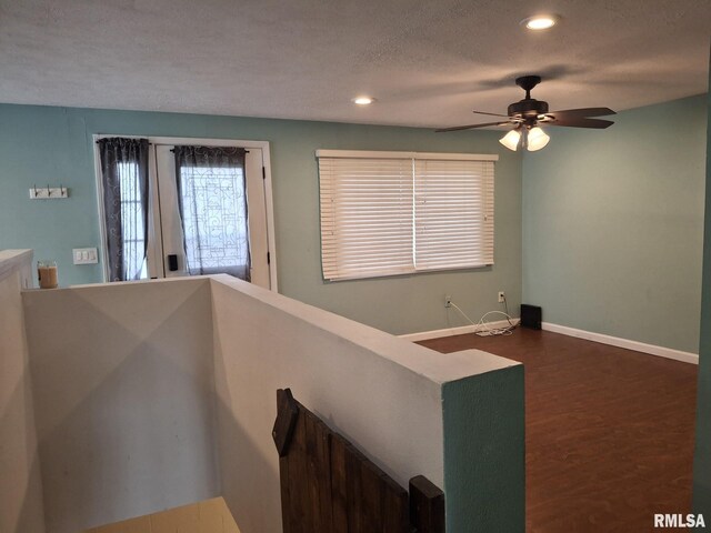 1907 Chicory Rd, Pekin, IL 61554 - stairs featuring a ceiling fan, a textured ceiling, baseboards, recessed lighting, and wood finished floors