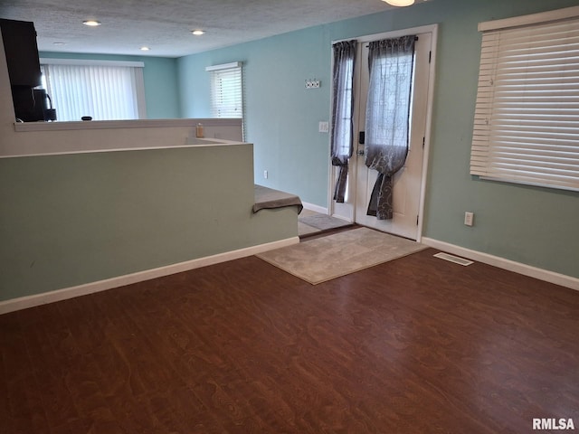 1907 Chicory Rd, Pekin, IL 61554 - foyer entrance featuring wood finished floors, baseboards, recessed lighting, and a textured ceiling