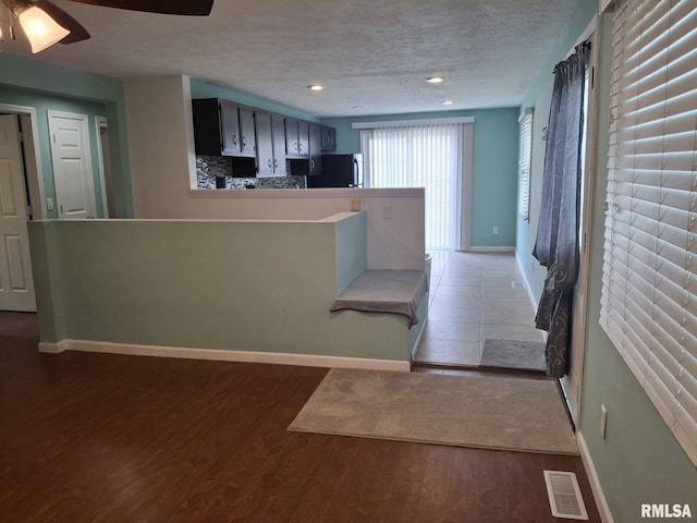 1907 Chicory Rd, Pekin, IL 61554 - kitchen featuring refrigerator, baseboards, wood finished floors, recessed lighting, and a textured ceiling