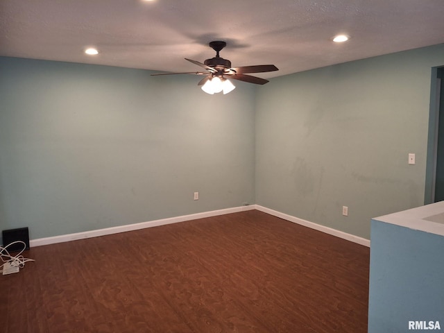1907 Chicory Rd, Pekin, IL 61554 - empty room with dark wood finished floors, ceiling fan, recessed lighting, and baseboards