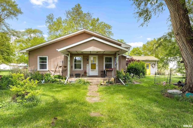 507 E Main St, Bryant, IL 61519 - view of front of home with a porch and a front yard