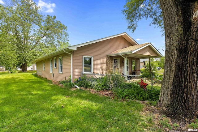 507 E Main St, Bryant, IL 61519 - view of property exterior featuring a lawn and covered porch