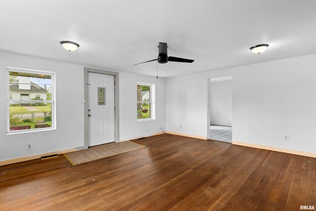 507 E Main St, Bryant, IL 61519 - entrance foyer with hardwood / wood-style flooring, a ceiling fan, and baseboards