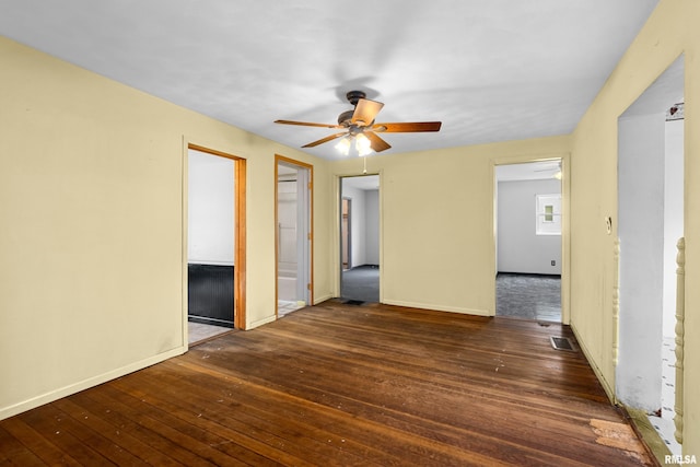 507 E Main St, Bryant, IL 61519 - spare room featuring hardwood / wood-style flooring, ceiling fan, and baseboards
