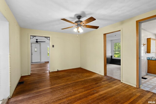 507 E Main St, Bryant, IL 61519 - unfurnished room with a ceiling fan, hardwood / wood-style floors, and baseboards