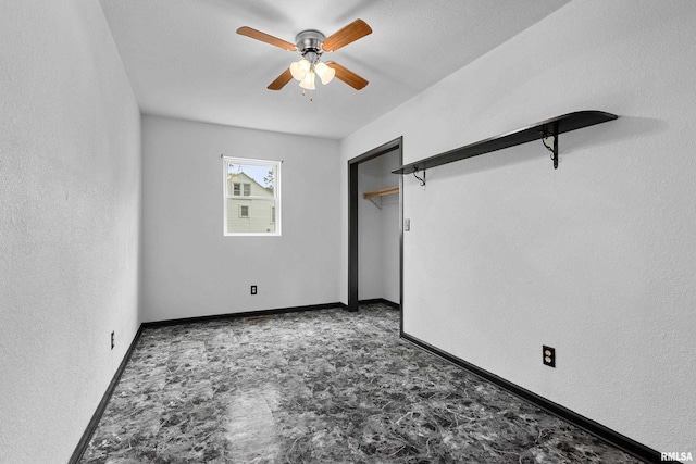 507 E Main St, Bryant, IL 61519 - unfurnished bedroom featuring baseboards and ceiling fan